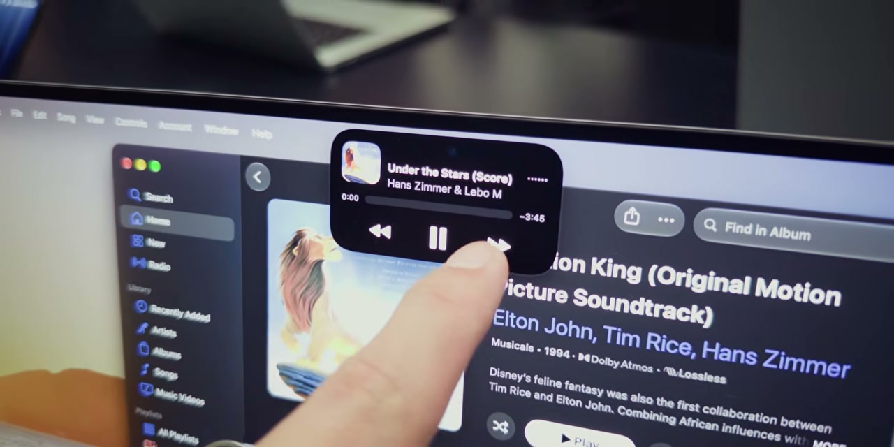 Kontrol pemutaran musik melalui widget di layar laptop
